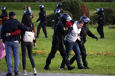Riot police detain a protester during an opposition rally to protest the presidential inauguration in Minsk, Belarus. (Photo | AP)