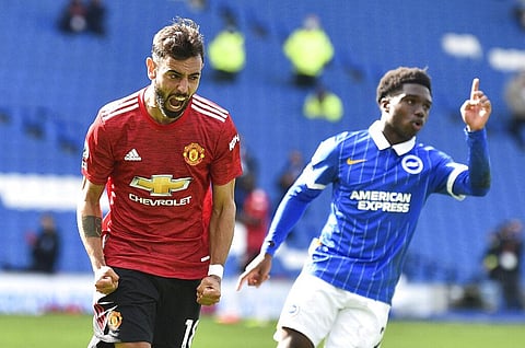 Manchester United's Bruno Fernandes celebrates after he scores his sides third goal from the penalty spot. (Photo | AP)