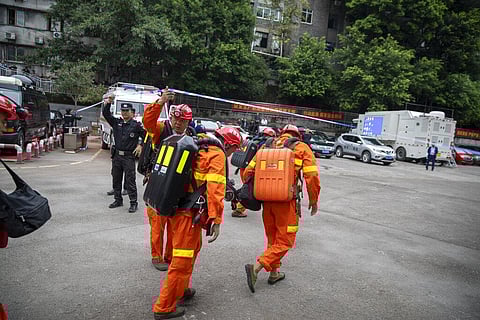 Rescuers arrive at a coal mine in southwest China's Chongqing Municipality, Sunday. (Photo | AP)