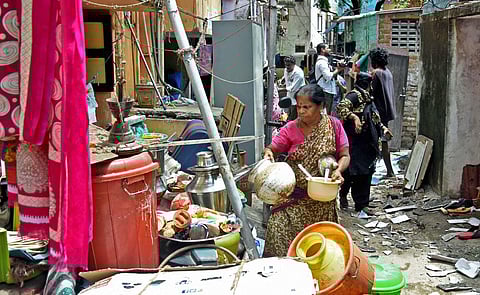 Evicted residents collecting their belongings. (Photo | Ashwin Prasath, EPS)