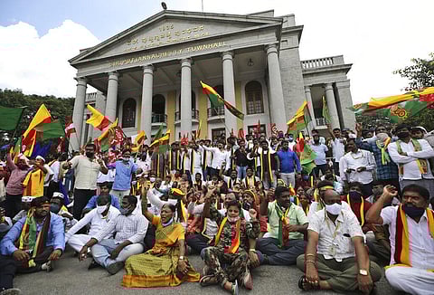 People shout anti-government slogans during a protest against farm bills at the Town Hall in Bengaluru, India, Monday, Sept. 28, 2020. (Photo | AP)