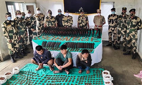 BSF men with the recovered arms, ammunition and the arrested carriers (Photo | EPS)