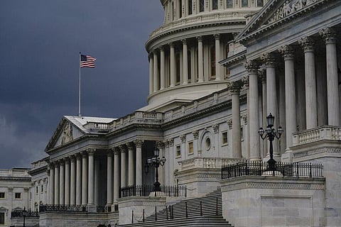 In this Aug. 3, 2020, file photo dark clouds and heavy rain sweep over the U.S. Capitol in Washington. (Photo | AP)