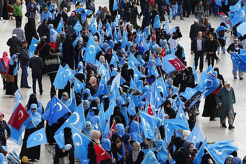 In this file photo dated Tuesday, Nov. 6, 2018, people from the Uighur community living in Turkey carry flags of what ethnic Uighurs call 'East Turkestan', during a protest in Istanbul. (Photo | AP)