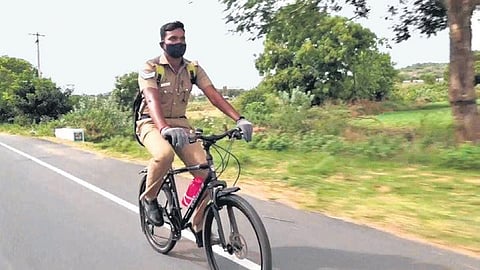 M Mohan, who cycles for 50 kms everyday, says people are more willing to talk to him about their problems because he patrols the streets on his bicycle | Express