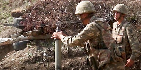 Azerbaijan's soldiers fire from a mortar at the contact line of the self-proclaimed Republic of Nagorno-Karabakh. (Photo | AP)