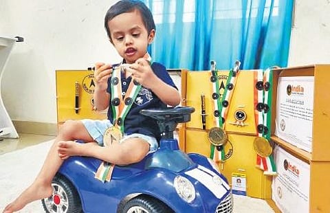 Ethan Aswin with his records