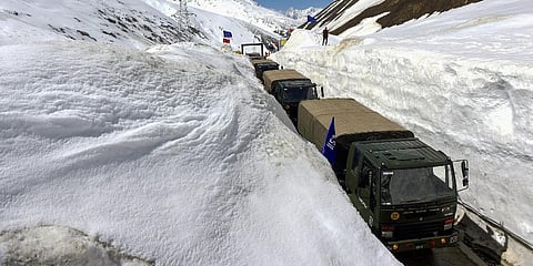 Indian Army convoy passes through Snow Bound Zojila Pass situated at a height of 11,516 feet on its way to frontier region of Ladakh. (File Photo | PTI)