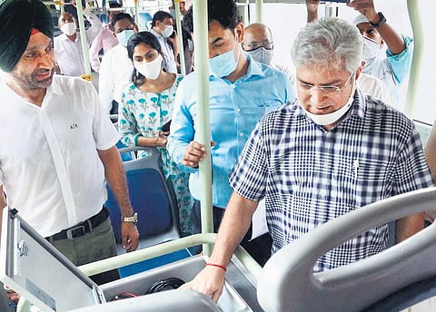 Transport Minister Kailash Gahlot inspects buses being fitted with CCTV, panic buttons & GPS. (Photo | Express)
