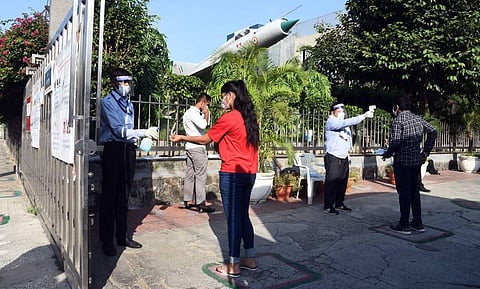 Thermal checks underway at a JEE exam centre in New Delhi. (Photo | Parveen Negi, EPS)
