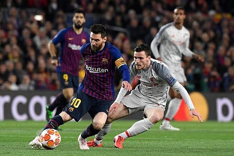 Liverpool's Andy Robertson and Lionel Messi (Photo | AP)