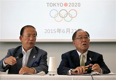 Tokyo 2020 Olympics CEO Toshiro Muto, left, and Honorary President Fujio Mitarai speak during a news conference in Tokyo | AP
