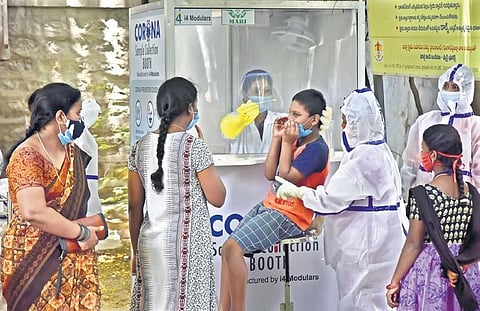 A boy gets tested for Covid-19 at a government hospital in Musheerabad on Friday | Vinay Madapu