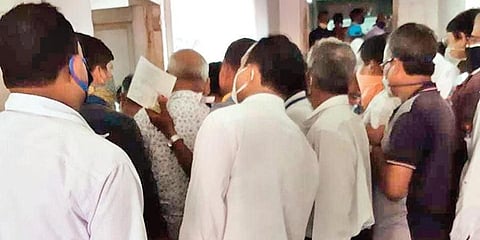 Teachers flout social distancing norm to avail HSC pass certificates at the BSE counters on Saturday. (Photo | EPS)