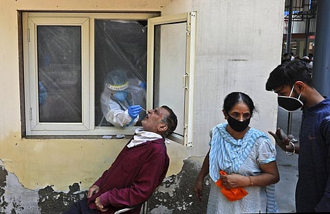 A health worker takes a nasal swab sample to test for COVID-19 in New Delhi, India, Saturday, Sept. 5, 2020. (Photo | AP)