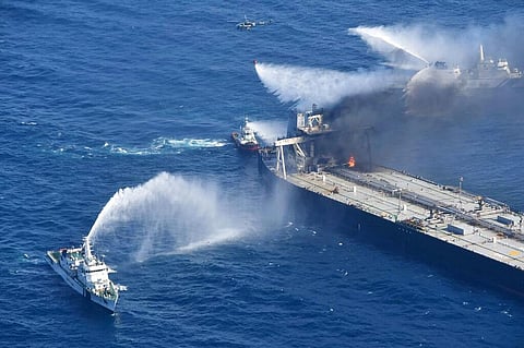 Sri Lanka Air Force, tug boats and ships battle the fire on MT New Diamond, off the eastern coast of Sri Lanka in the Indian Ocean. (Photo | AP)