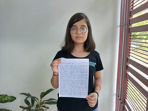 Climate activist Ridhima Pandey with the letter to PM Modi (Photo | EPS)