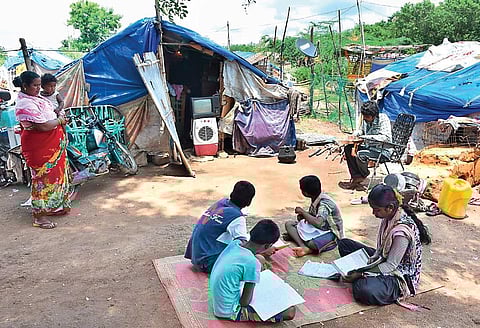 Schoolchildren attend online classes in Karimnagar town on Monday