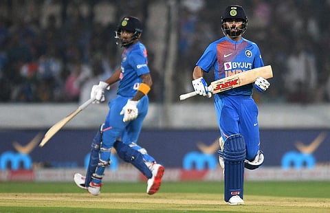 Indian cricket captain Virat Kohli (R) and KL Rahul runs between the wickets. (Photo | AFP)
