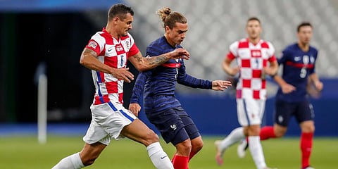 France's Antoine Griezmann (R) duels for the ball with Croatia's Dejan Lovren during their UEFA Nations League match at the Stade de France stadium in Saint-Denis. (Photo | AP)