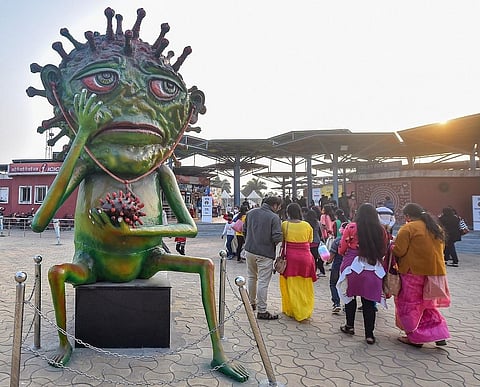 A model of coronavirus installed at the entrance point of a park as part of an awareness campaign against the pandemic in Kolkata. (Photo | PTI)