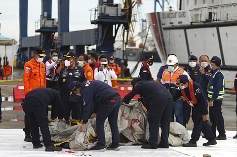 Rescuers inspect debris found in the waters around the location where a Sriwijaya Air passenger jet has lost contact with air traffic controllers shortly after the takeoff. (Photo | AP)