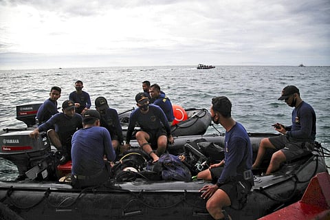 Indonesian Navy divers take part in the search for the crashed Sriwijaya Air passenger jet in the waters off Java island on Sunday. (Photo | AP)