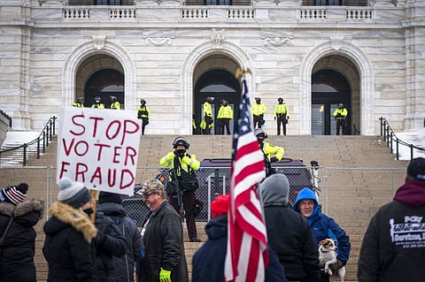 Minnesota State troopers guard the Capitol building during a rally supporting President Trump at the Minnesota Capitol, Saturday, Jan. 9, 2021 in St. Paul, Minn. (Photo | AP)