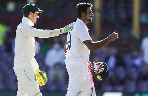 Australian captain Tim Paine, left, congratulates not out batsman India's Ravichandran Ashwin. (Photo | AP)