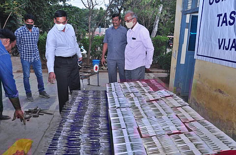 Task force sleuths seize rooster knives in a raid at Tempalli village in Unguturu mandal of Krishna district on Monday. (Photo | EPS)