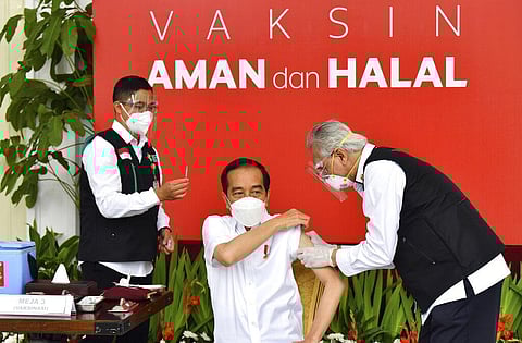 President Joko Widodo prepares to receive a shot of COVID-19 vaccine at Merdeka Palace in Jakarta, Indonesia, Wednesday, Jan. 13, 2021. (Photo | AP)