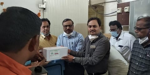 Kalaburagi DHO Dr Rajashekhar Mali and RCHO Dr Mankar carry boxes of Covishield vaccine doses. (File photo| EPS)