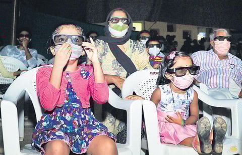Kids watching a movie at Nishagandhi open-air auditorium during a recent screening organised by the KSFDC | Vincent Pulickal