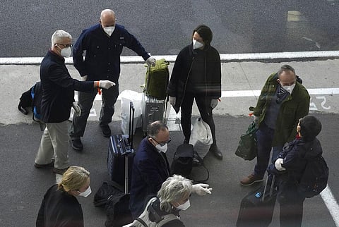 Members of a WHO team arrives in Wuhan in central China's Hubei province on Thursday, Jan. 14, 2021. (Photo | AP)
