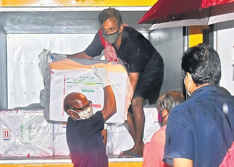 Workers unloading the first consignment of Pune-based Serum Institute’s Covishield vaccine at the regional vaccine store in Thiruvananthapuram on Wednesday | B P Deepu