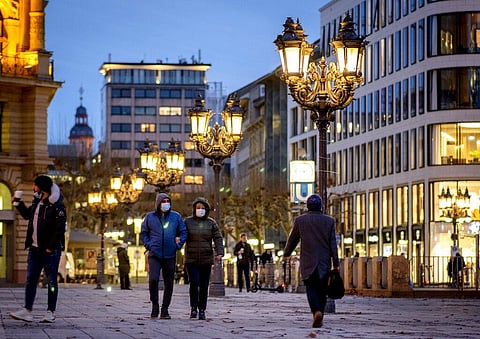 People wearing face masks walk through downtown Frankfurt, Germany, Thursday, Jan. 14, 2021. (Photo | AP)