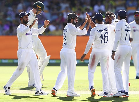 Thangarasu Natarajan, second right, is congratulated by teammates after dismissing of Australia's Marnus Labuschagne. (Photo | AP)