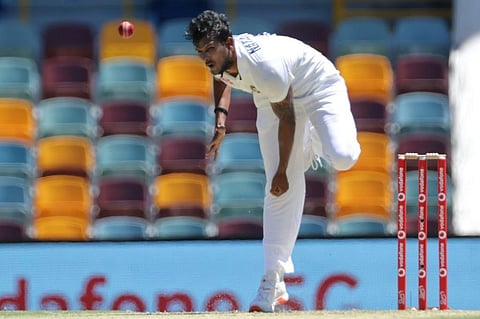 Thangarasu Natarajan bowls on day one of the fourth cricket Test match between Australia and India at the Gabba. (Photo | AFP)