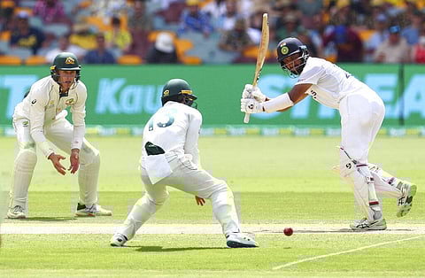Cheteshwar Pujara bats during play on day two of the fourth cricket test between India and Australia at the Gabba. (Photo | AP)