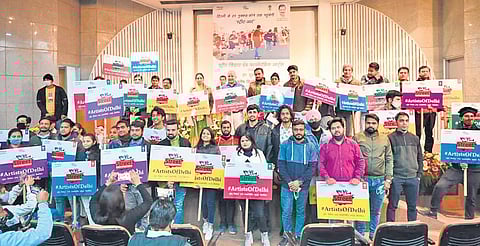 Deputy Chief Minister Manish Sisodia with the artists at the launch of AAP government’s flagship scheme. (Photo | Twitter)