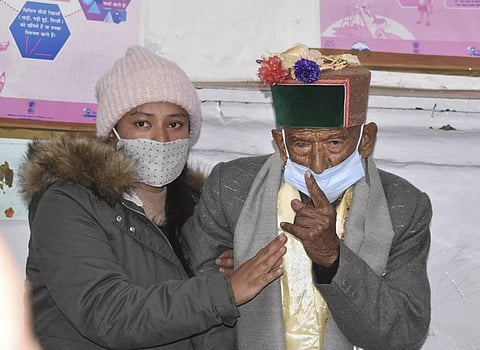 Shyam Saran Negi believed to be India's oldest voter at 103 years of age shows his inked finger after casting vote for Panchayat elections at Kalpa.