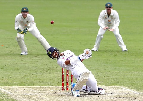 Washington Sundar ducks to avoid a bouncer during play on day three of the fourth cricket test between India and Australia. (Photo | AP)