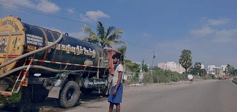 A private sewage tanker driver watches as the sewage is being let off into the storm water drain alongside AH-45 near AGS Dental College (Photo | Express)