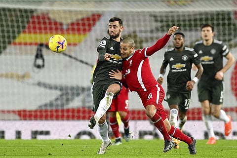 Liverpool's Thiago vies for the ball with Manchester United's Bruno Fernandes, left, during the English Premier League match. (photo | AP)