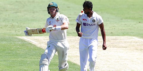 Australian batsman Marnus Labuschagne runs past India's Thangarasu Natarajan during the Gabba Test. (Photo | AP)