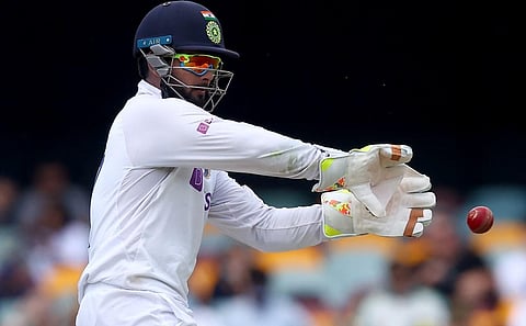 Rishabh Pant fields the ball on day four of the fourth cricket Test match between Australia and India. (Photo | AFP)