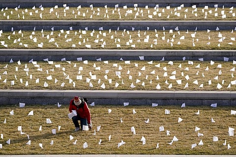 The 1,665 flags represent the area residents who died in the coronavirus pandemic and the display was part of a national memorial to lives lost to COVID-19. (Photo | AP)