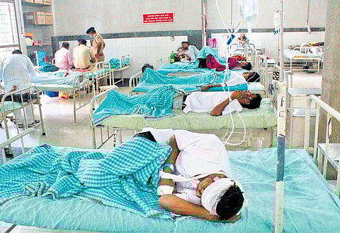 Labourers injured in the accident in Surat admitted to a hospital on Tuesday. (Photo | PTI)
