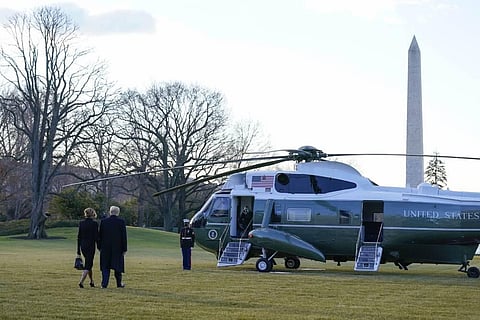 President Donald Trump and first lady Melania Trump walk to board Marine One on the South Lawn of the White House Wednesday Jan. 20 2021. (Photo | AP)