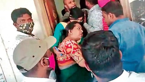 TRS corporator Gadwal Vijayalakshmi argues with the employees at the Shaikpet Tahsildar’s office. (Photo | Express)